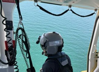 Man rescued after boat capsizes near Curtis Island